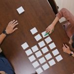 Top view of couple discuss on memo paper on the table